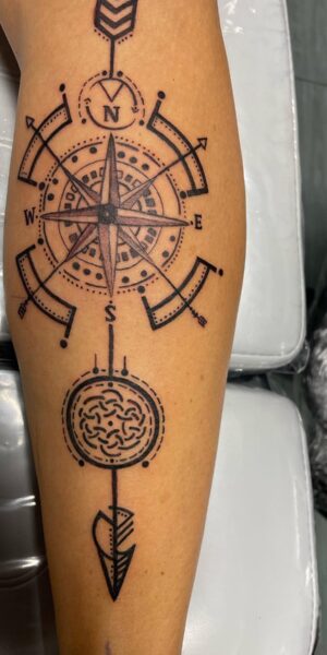 Symbolic Linework Tattoo Linework tattoo featuring symbolic and geometric elements arranged vertically