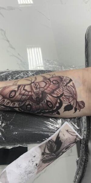 Tattoo Session in Progress Tattoo artist creating custom artwork during a studio session