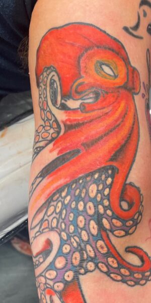 Color Tattoo Sleeve Detail Vibrant color tattoo design featuring bold lines and shading
