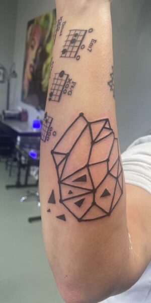 Geometric Arm Tattoo Geometric tattoo design inked on the upper arm