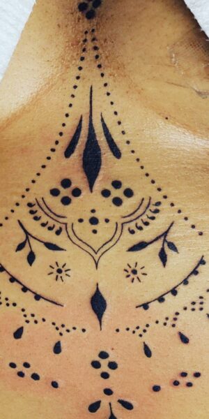 Ornamental Back Tattoo Ornamental tattoo design placed on the upper back with symmetrical linework