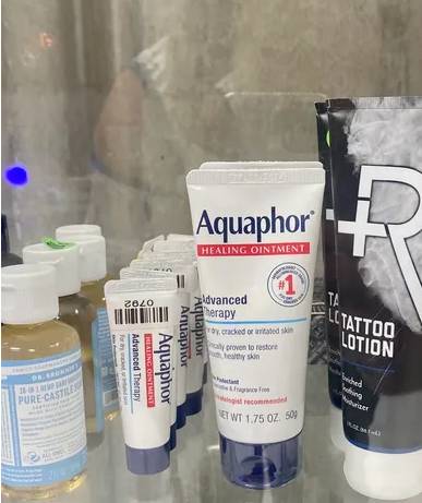 Female tattoo artist Youngsville LA creating custom tattoos in a sterile environment