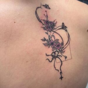 Fine line floral tattoo design featuring delicate linework and detailed shading