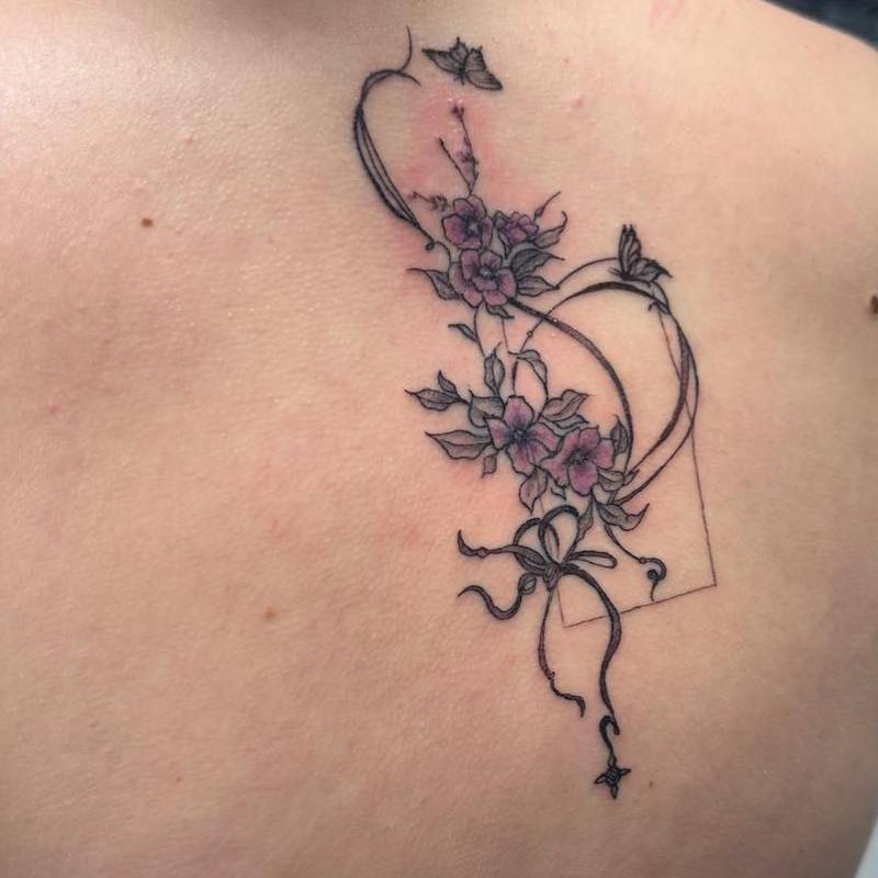Fine line floral tattoo design featuring delicate linework and detailed shading