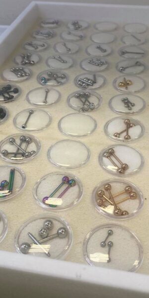 Close-up of piercing rings and studs available at Inkophilia in Youngsville, LA
